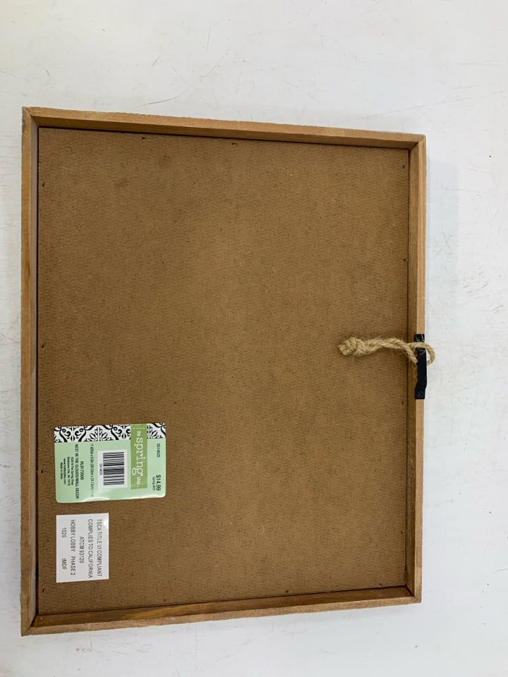 EMBROIDERED LOVE LIVES HERE NAVY BLUE BACKGROUND W/ FLOWERS.