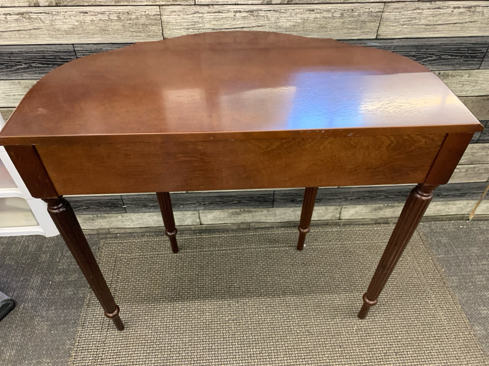 MAROON HALF MOON TABLE W 1 DRAWER.