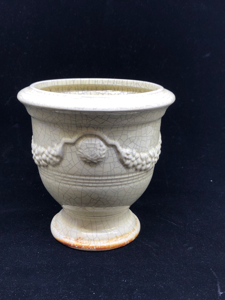 CREAM CRACKLE URN SHAPED VASE W EMBOSSED PATTERN.