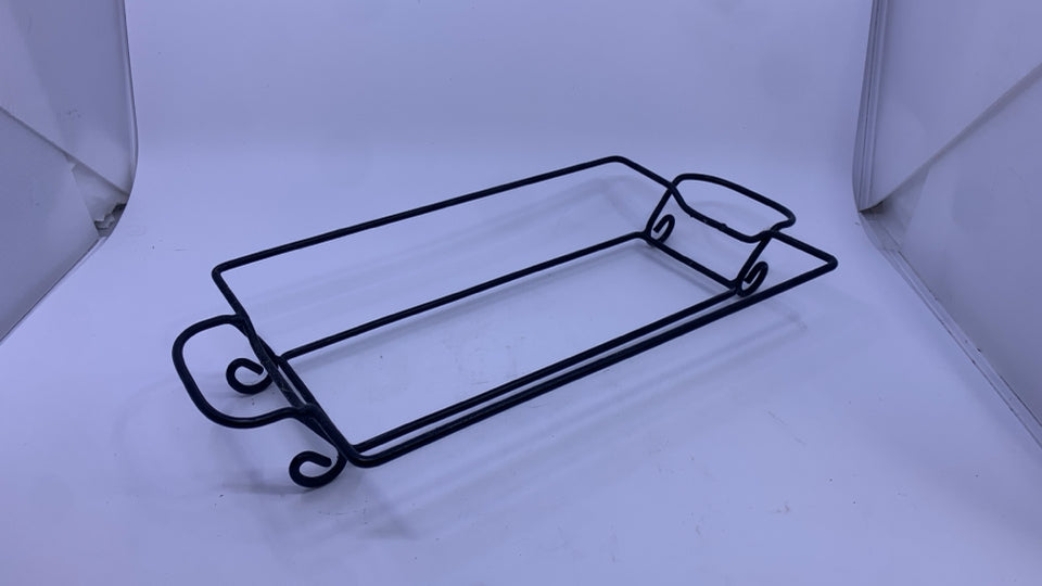 OLIVE CASSEROLE DISH IN METAL HOLDER.