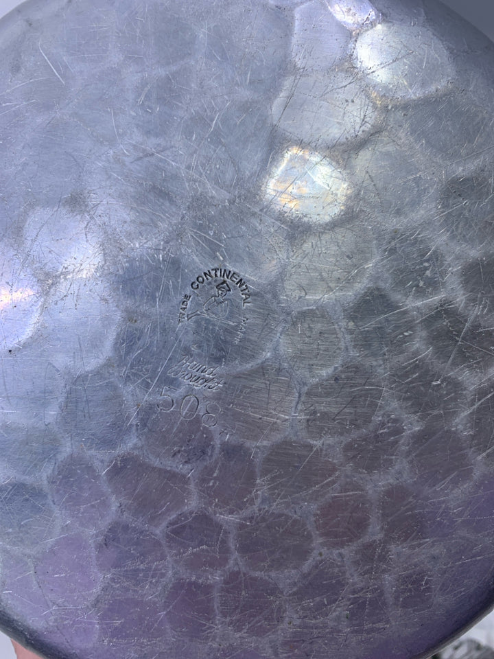 SILVER METAL HAMMERED SHALLOW W/ HANDLE EMBOSSED FLORAL ON LID.