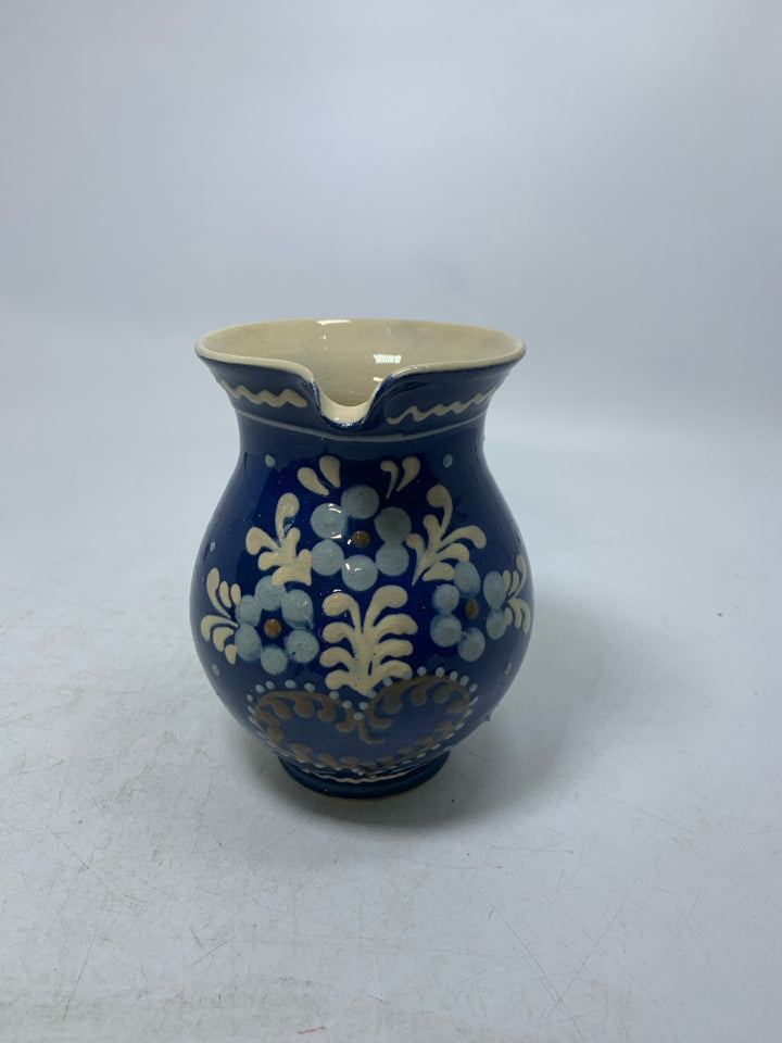 DARK BLUE CREAMER W/ PAINTED FLOWERS.