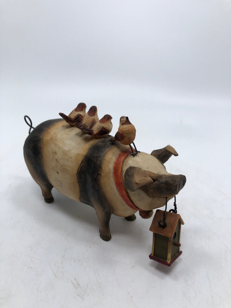 BIRDS ON PIG CARVED FIGURE.