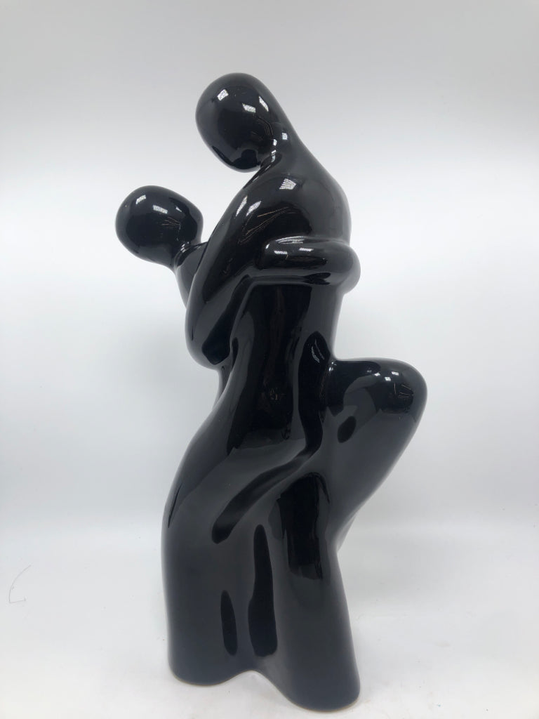 DANCING COUPLE BLACK-GLAZED FIGURINE.