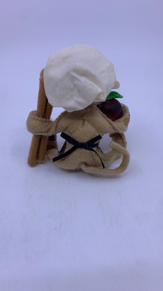 ANNA LEE FELT DOG HOLDING APPLE AND CINNAMON.