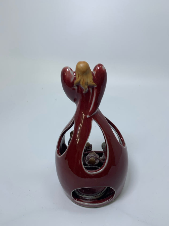 POTTERY DARK RED ANGEL W/ MARY/JOSEPH INSIDE TEA LIGHT HOLDER.