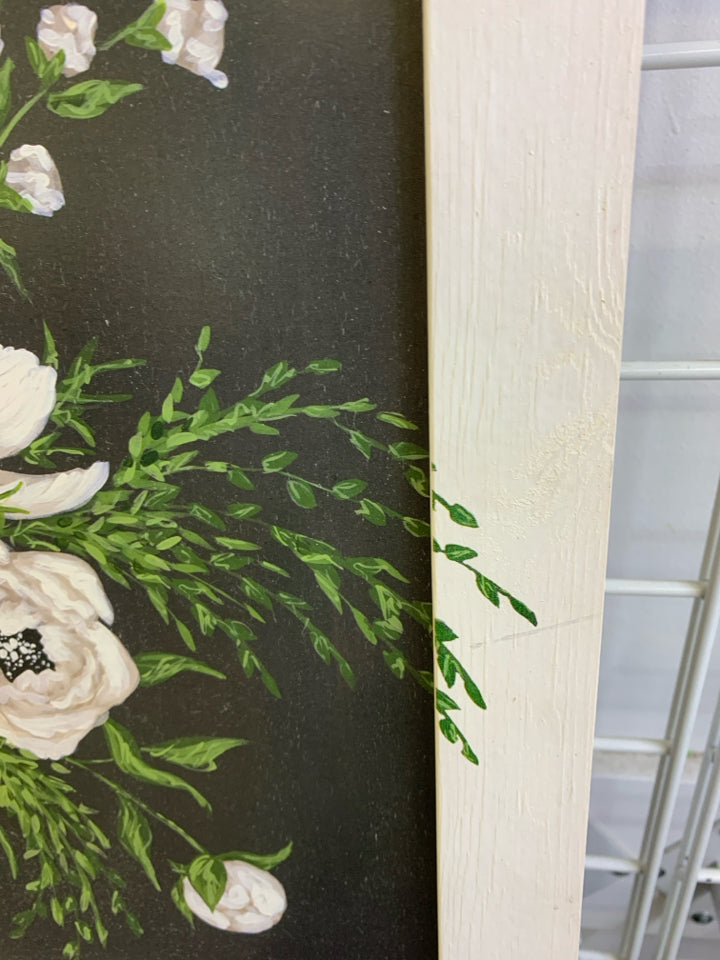 BLACK TRUCK W WHITE FLORAL IN WHITE FRAME WALL DECOR.