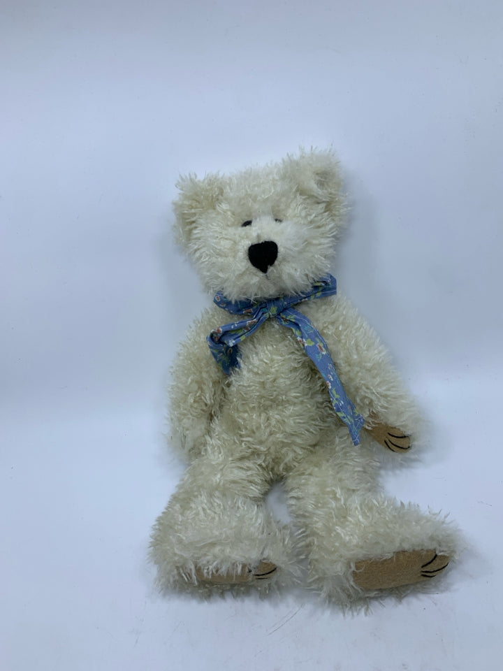 WHITE SHAG BEAR W/ FLORAL BOW.