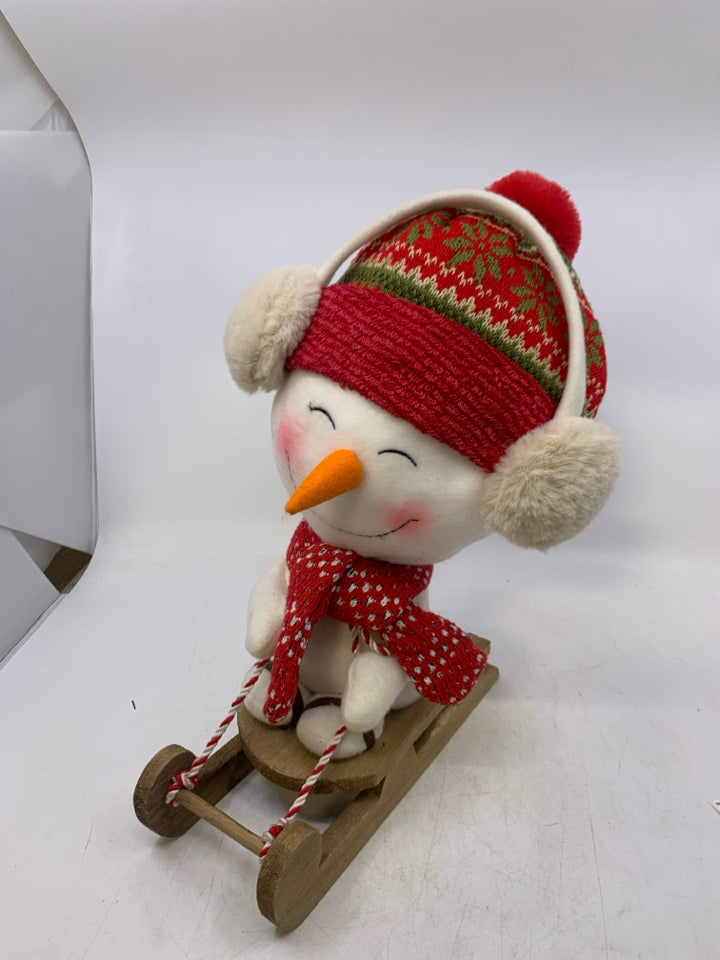 LARGE PLUSH SNOWMAN ON SLED.