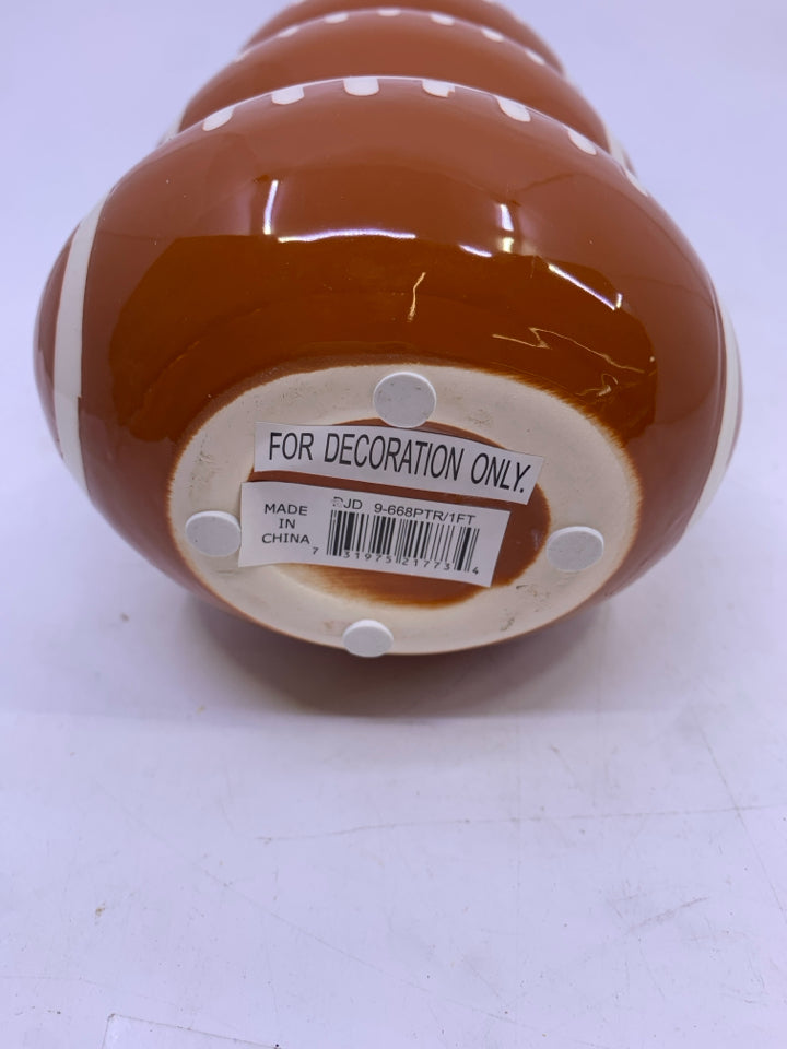 STACKED FOOTBALL CERAMIC VASE.