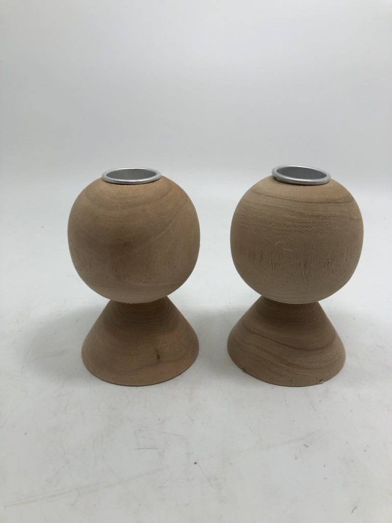 2 SM WOOD CARVED CANDLE HOLDERS.