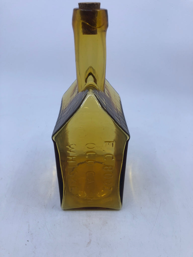 VTG OLD CABIN WHISKEY HOUSE SHAPED AMBER GLASS EMPTY DECANTER.