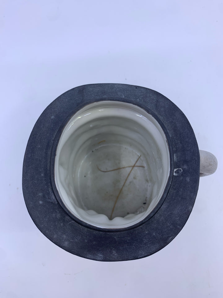 VTG MAN W BLACK HAT MUG.