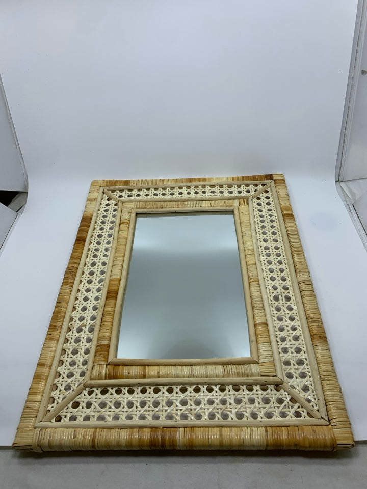 WOVEN RATTAN MIRROR.