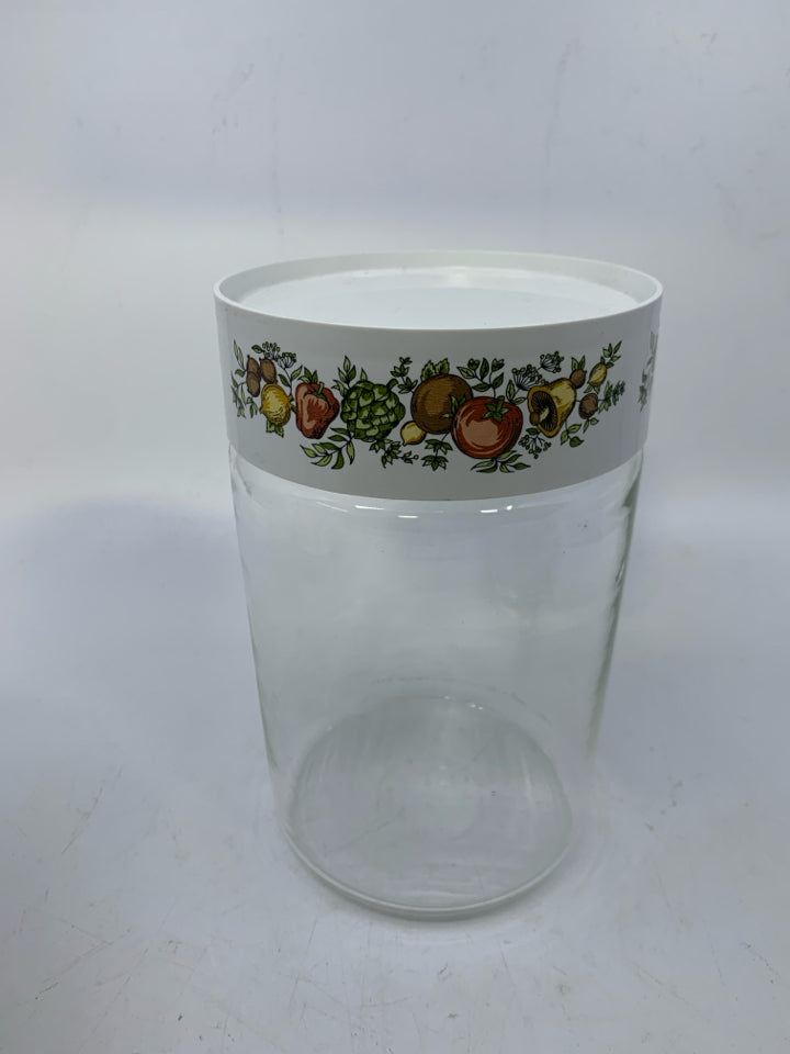 CLEAR GLASS CANISTER W/ VEGGIE PLASTIC TOP.