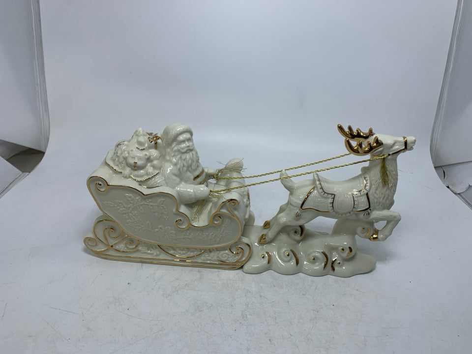 MIKASA IVORY SANTA IN SLAY W/ REINDEER GOLD DETAILS.