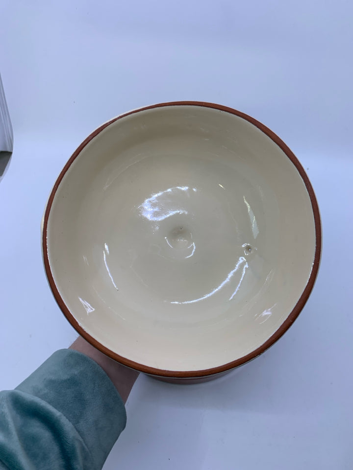 TERRA COTTA TORTILLA WARMER W/ PEPPERS ON IT.