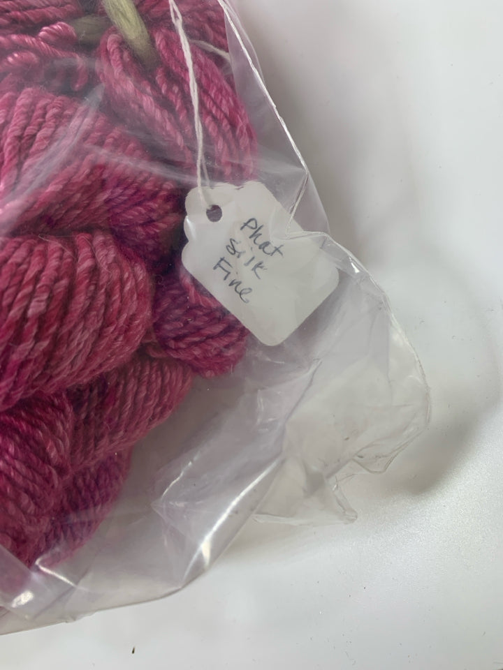 LARGE BAG OF PINK WOOL YARN.