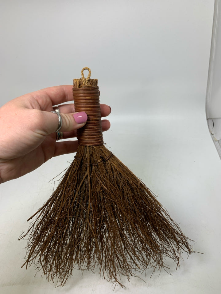 STICK BROOM WALL HANGING.