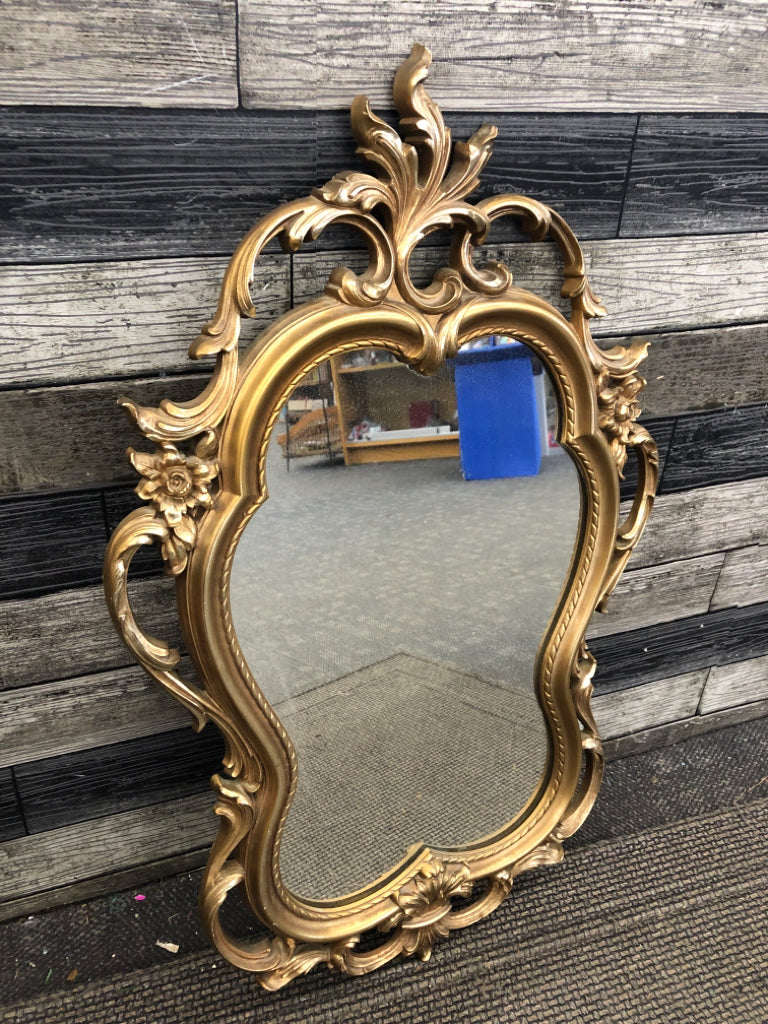GOLD ORNATE MIRROR.