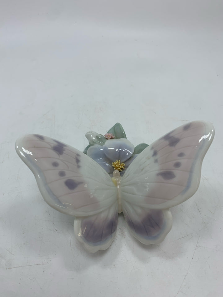 PORCELAIN BUTTERFLY ON FLOWER FIGURINE.