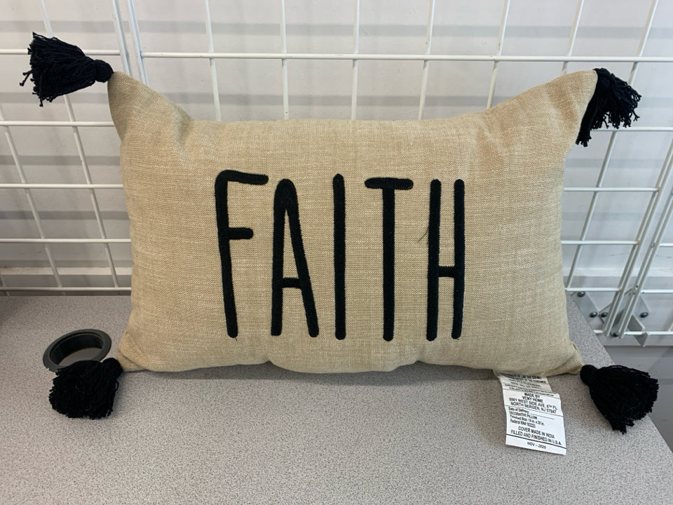 FAITH BURLAP PILLOW W/BLACK TASSELS.