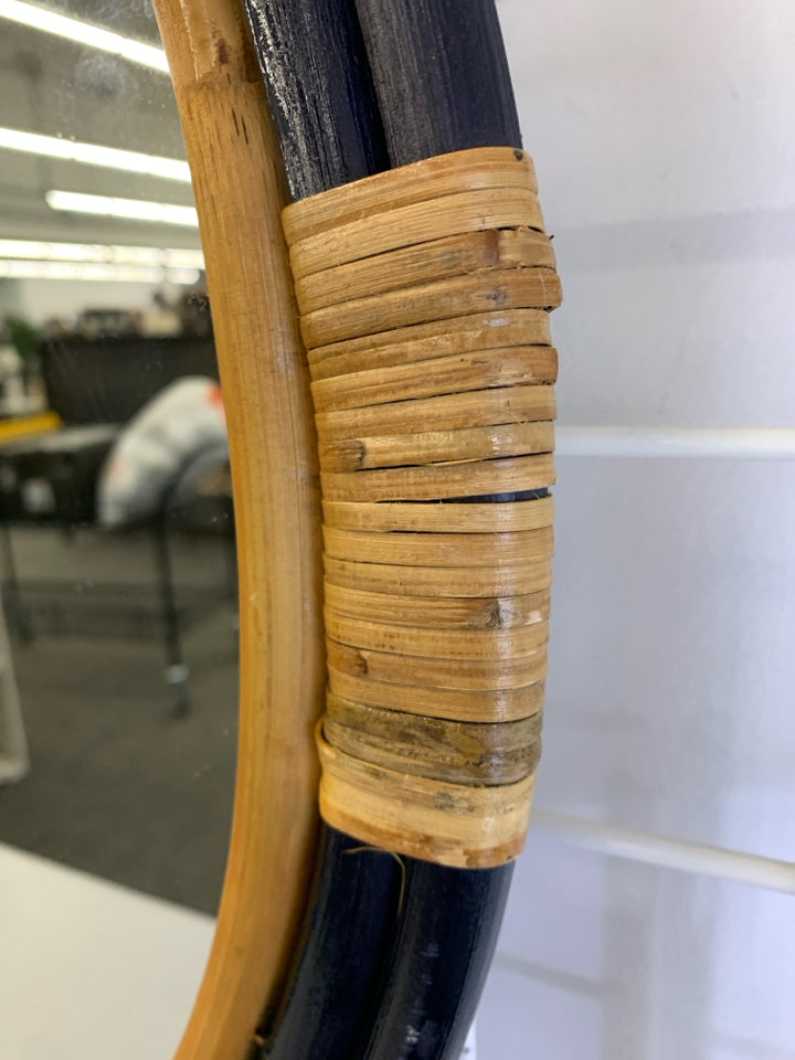 CIRCULAR MIRROR W/ RATTAN FRAME WALL HANGING.