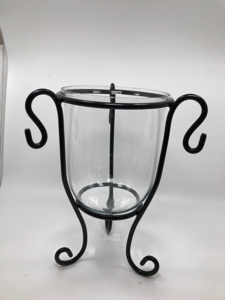METAL SCROLL W/CLEAR GLASS CANDLE HOLDER.