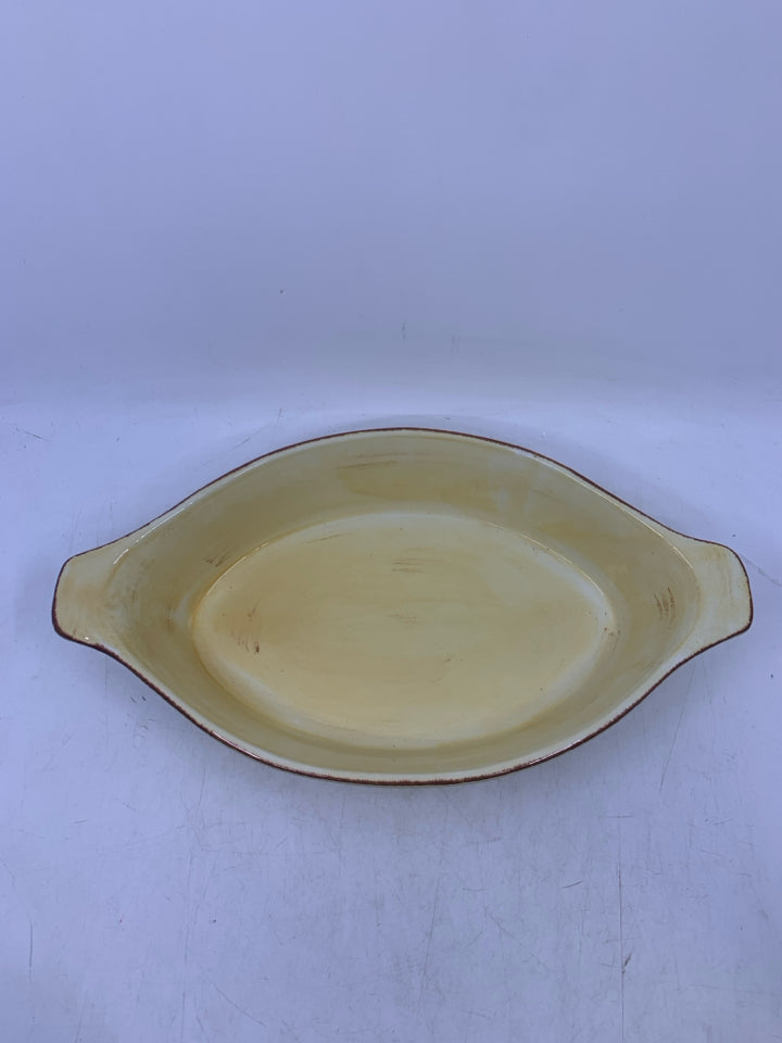 OVAL LIGHT YELLOW CERAMIC BAKER W/ HANDLES.
