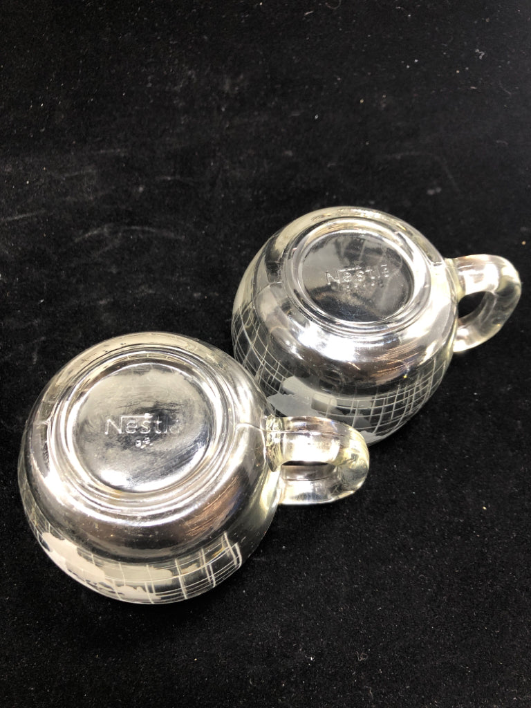 2 VTG NESTLE GLOBE MUGS.