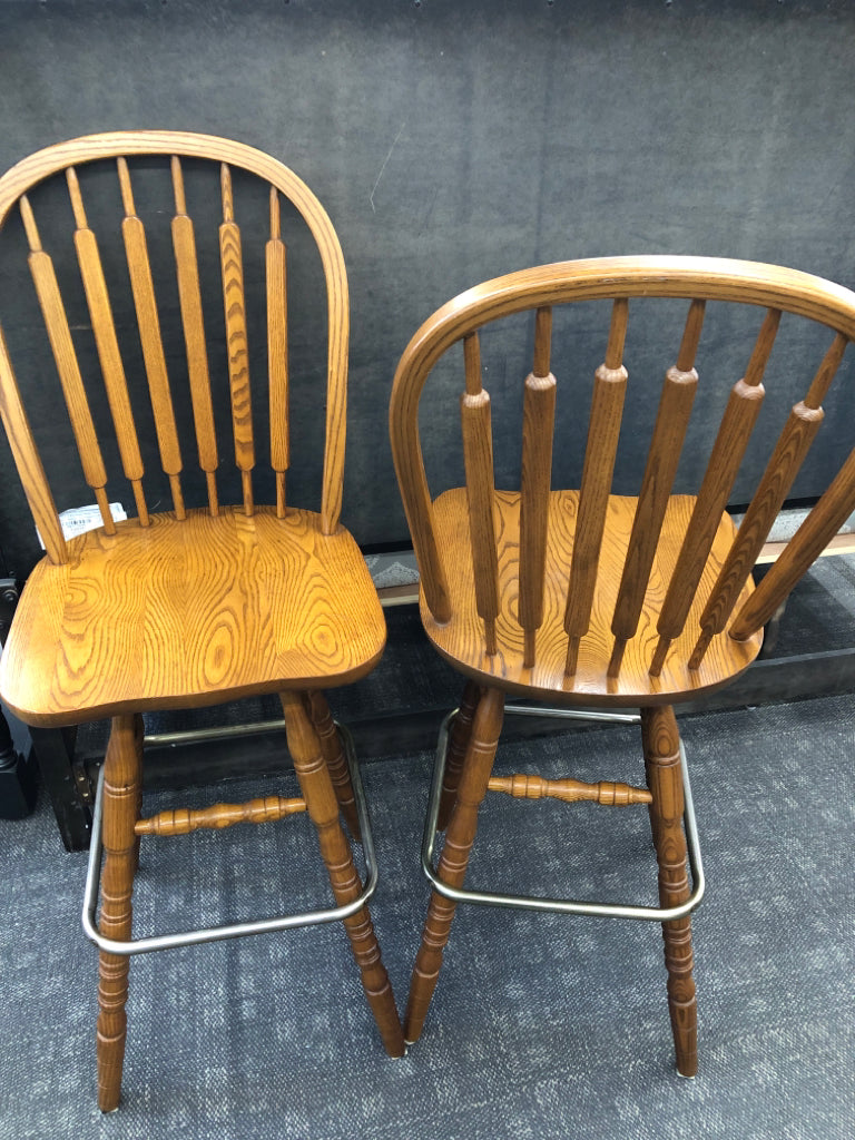 2 WOODEN SWIVEL CHAIRS.