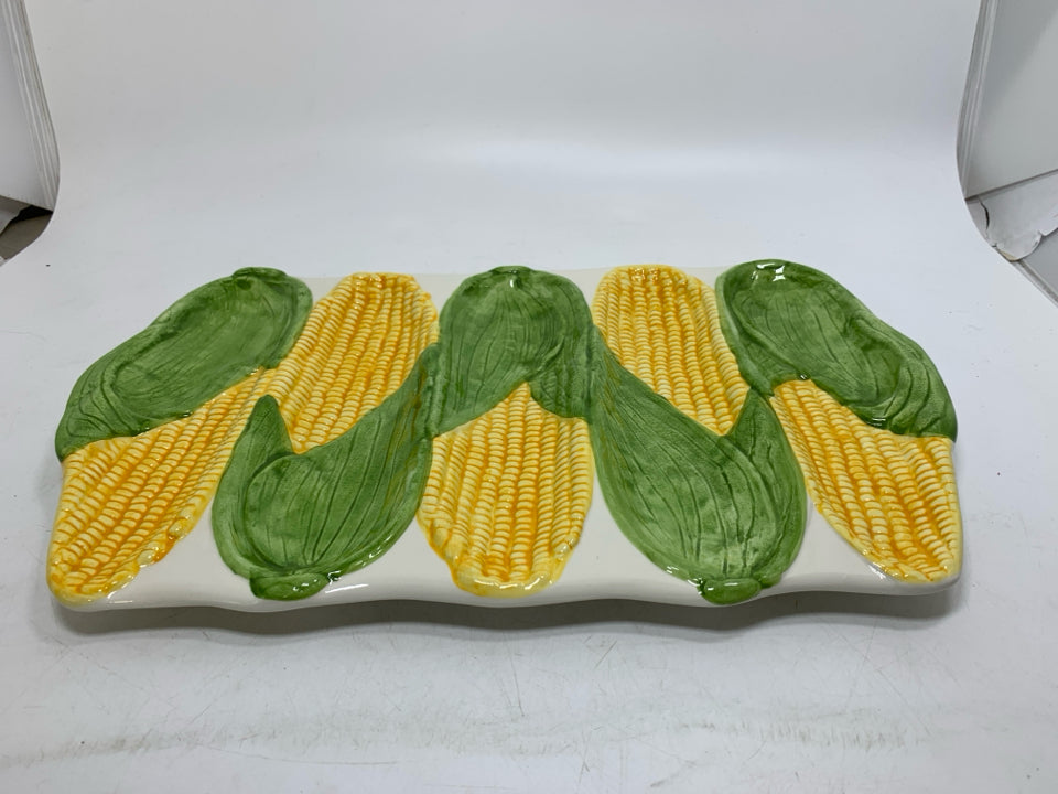 5 SLOT TEXTURED CORN HOLDER PLATE MADE IN PORTUGAL W/ HANDLES.