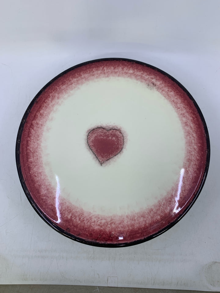 FOOTED CERAMIC CREAM/RED W/ HEART IN CENTER BLACK EDGE.