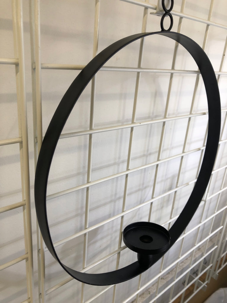 BLACK METAL RING CANDLESTICK HOLDER WALL HANGING.