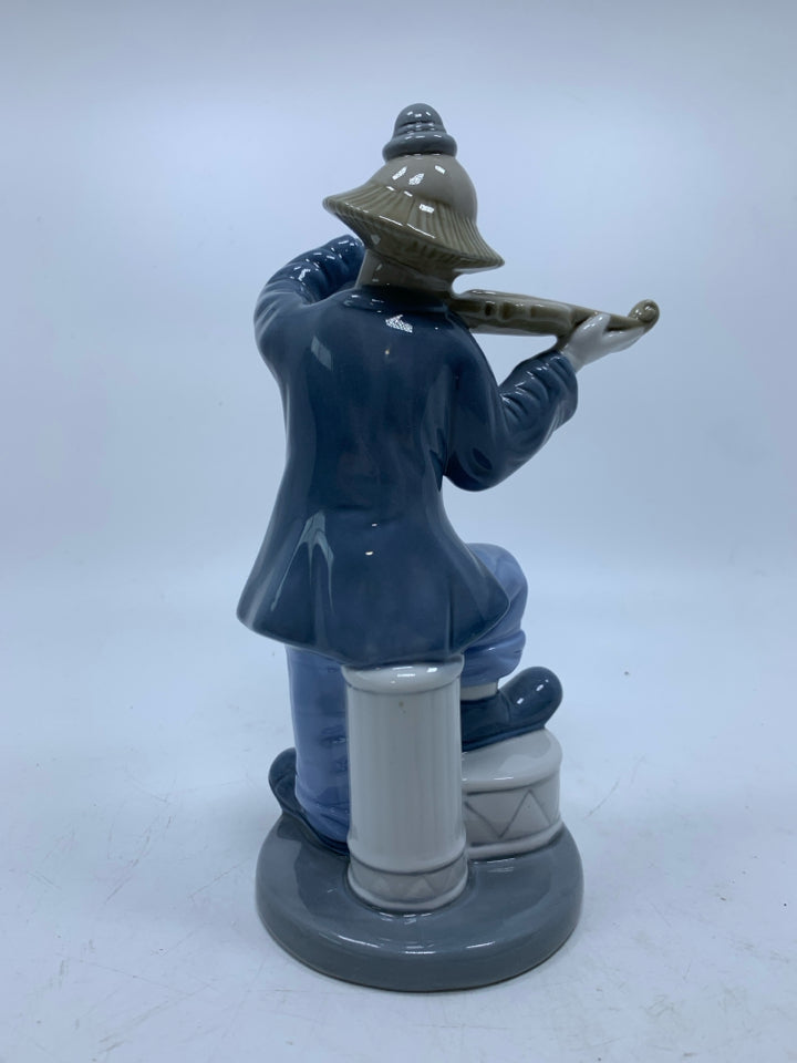 PORCELAIN CLOWN PLAYING THE FIDDLE CUERNAVACA MEXICO.