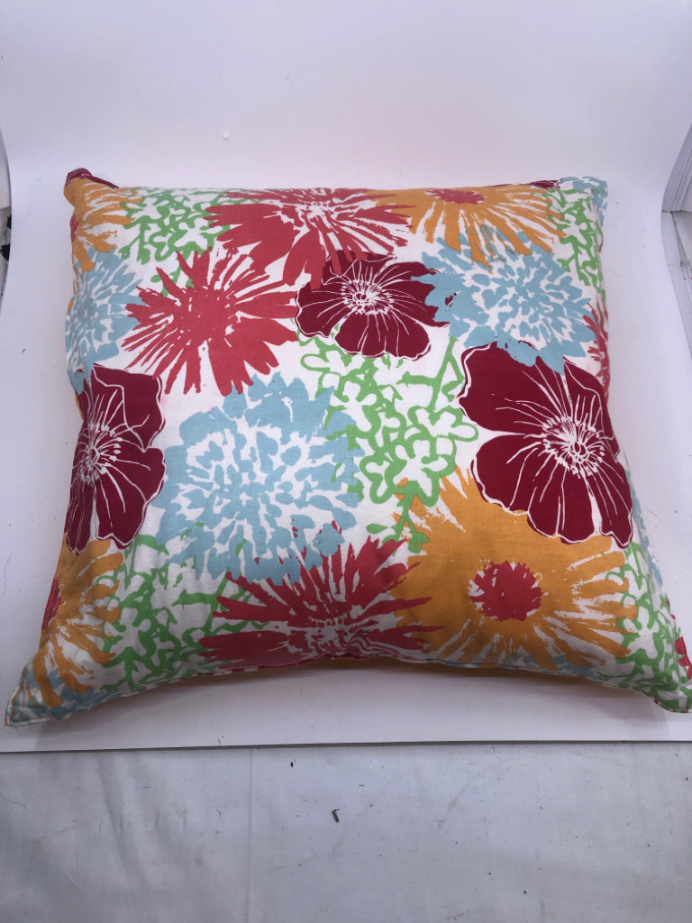 COLORFUL FLOWER W/ SOLID ORANGE BACK PILLOWS.