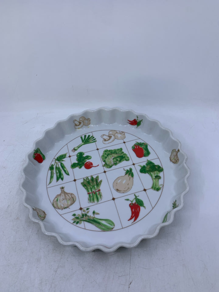 WHITE QUICHE DISH W/ ASSORTED VEGGIES.