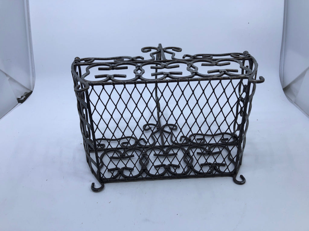 FOOTED METAL SCROLL BASKET W/ HANDLE.