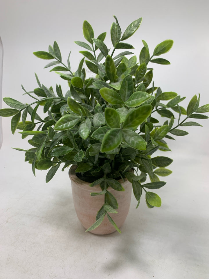 TERRA COTTA PLANTER W/ FAUX LEAVES.