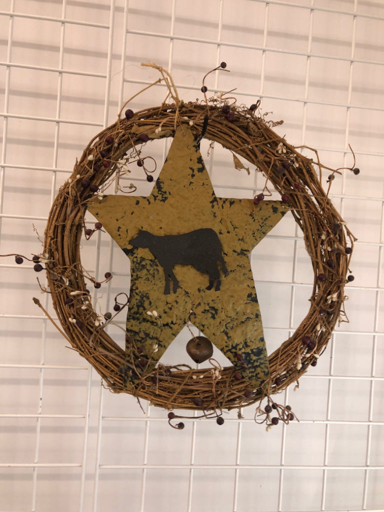 PRIMITIVE METAL COW WREATH.
