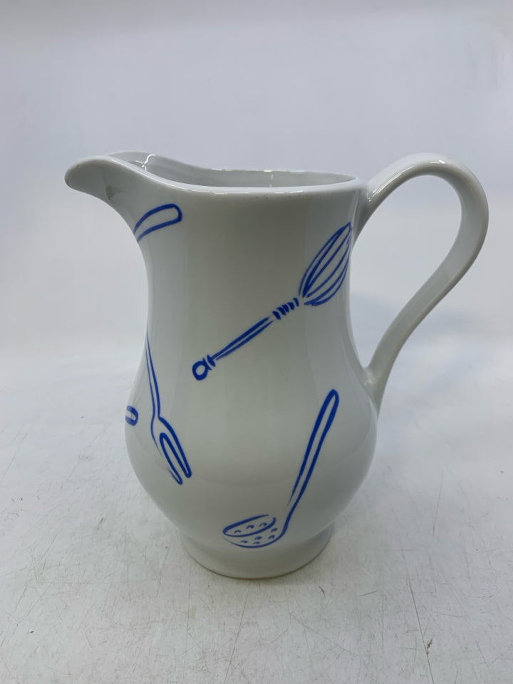 CERAMIC W/ ASSORTED BLUE UTENSILS.