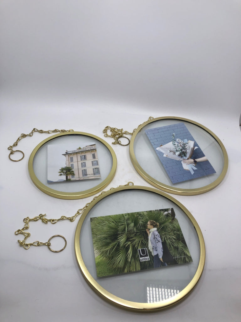 3 ROUND GOLD HANGING PHOTO HOLDERS.