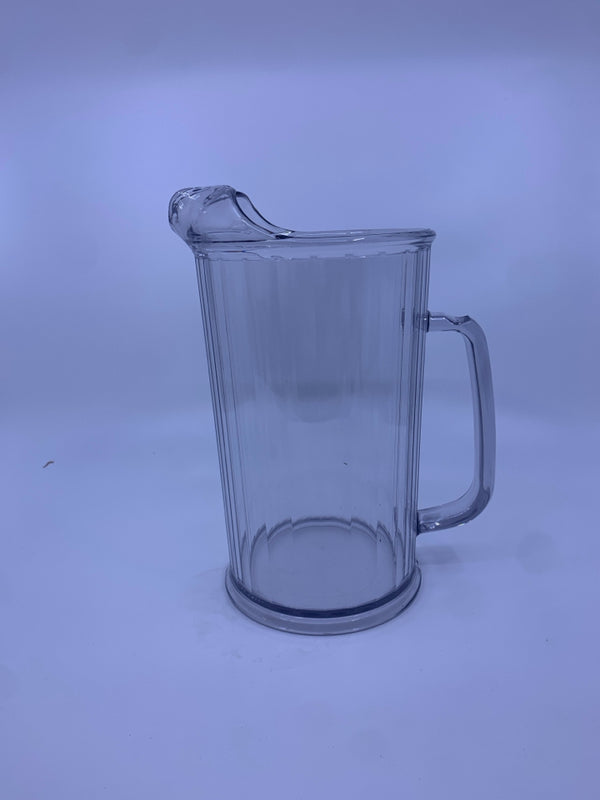 CLEAR RIBBED PLASTIC PITCHER.