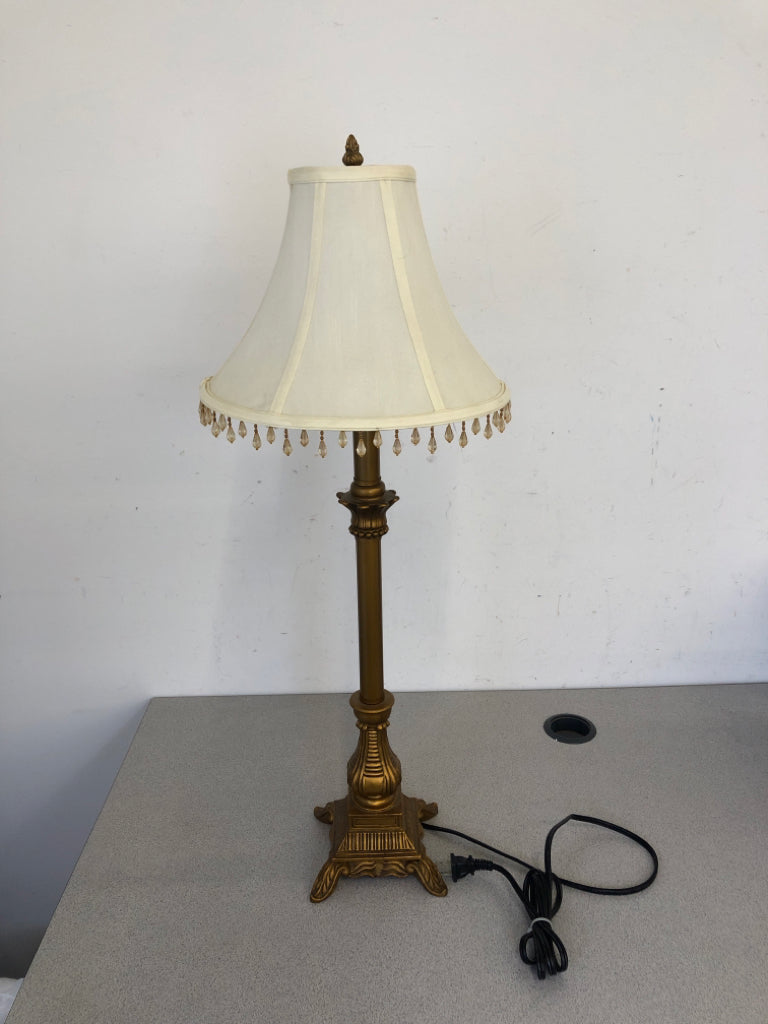 GOLD SKINNY BASE LAMP W WHITE SHADE AND JEWELS.