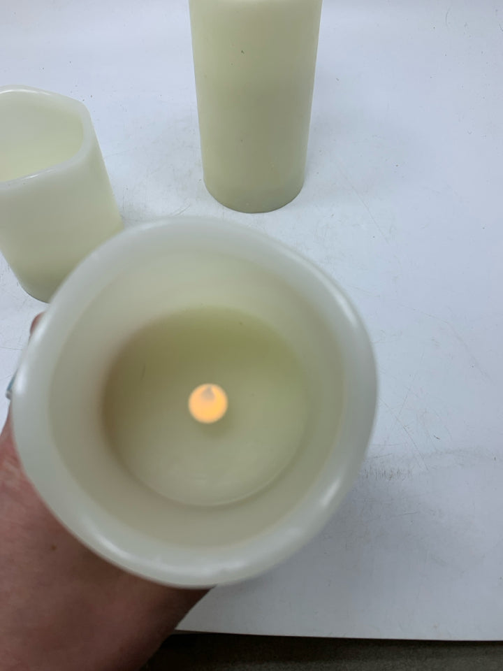 3 FAUX BATTERY POWERED CANDLES.