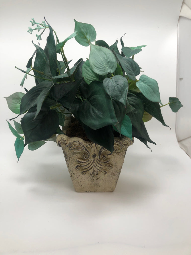 GREENERY IN FAUX STONE POT.