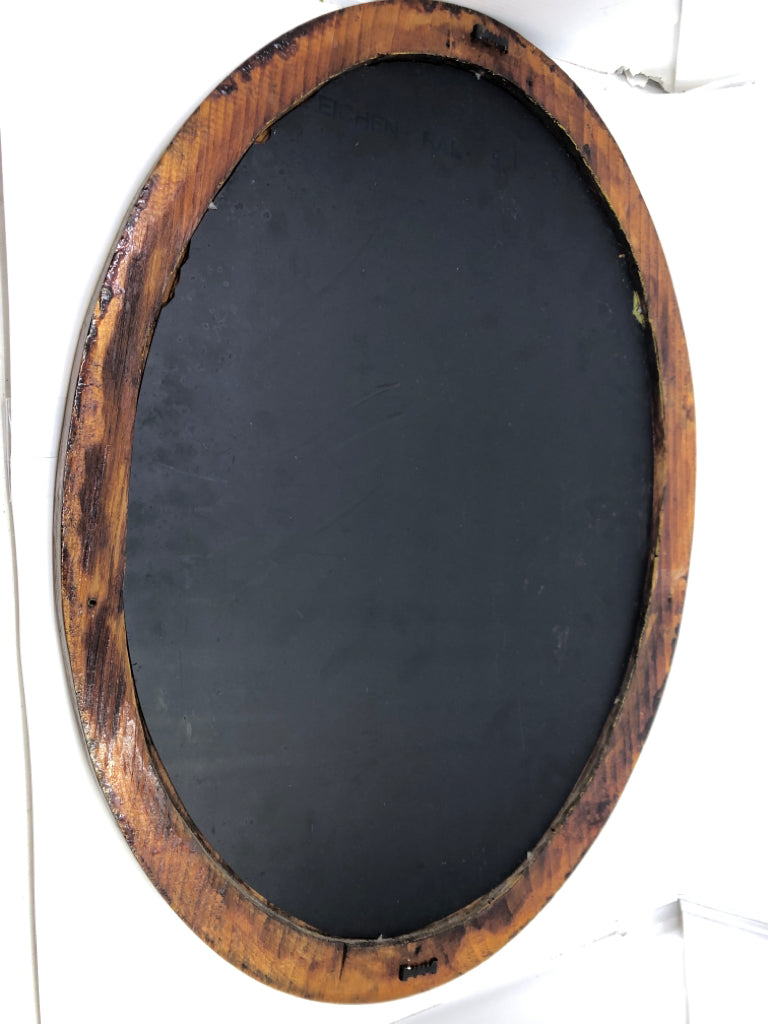 OVAL WOOD FRAME MIRROR.
