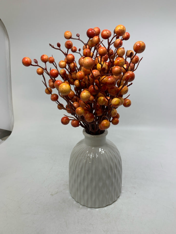 WHITE TEXTURED VASE W/ ORANGE BALLS ARRANGEMENT.