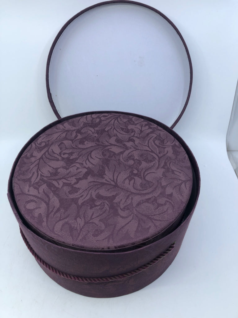2 NESTING PURPLE FABRIC CIRCLE HAT BOXES.