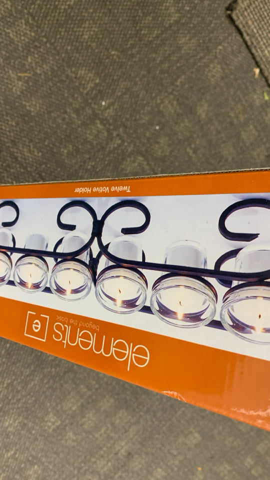 NIB 12 SPOT VOTIVE HOLDER.